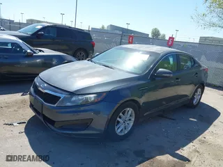 2011 Kia Optima LX with VIN KNAGM4A78B5066644, listed as a IAAI auction lot 42011172 with 172,862 mi miles. Bid and sale history available at carsss.com. Image 2.