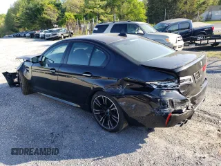 2018 BMW M5 z VIN WBSJF0C5XJB282107, wystawiony jako Copart lot #49979943 z przebiegiem 55 243 mil mil oraz . Historia ofert i sprzedaży dostępna na DreamBid. Obrazek 2.