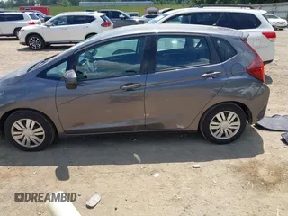 2015 Honda Fit LX with VIN 3HGGK5G57FM747786, listed as a IAAI auction lot 42656703 with 102,637 mi miles and . Bid and sale history available at DreamBid. Image 14.