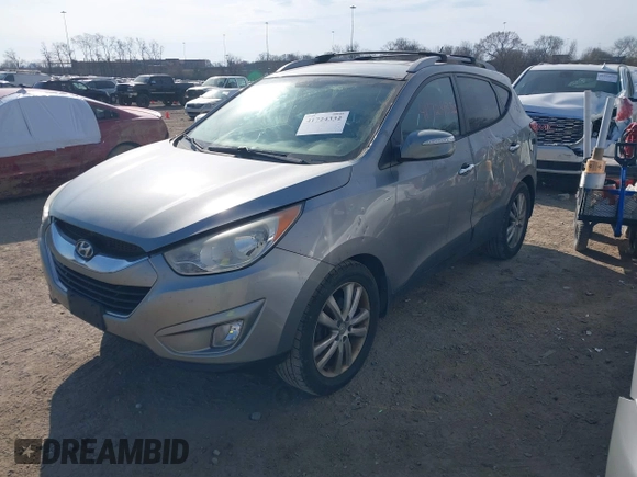 2013 Hyundai Tucson GLS with VIN KM8JU3AC0DU572232, listed as a IAAI auction lot 41724332 with 232,661 mi miles. Bid and sale history available at carsss.com. Image 2.