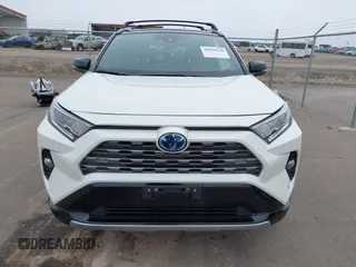 2021 Toyota RAV4 Hybrid XSE with VIN 2T3E6RFV4MW021009, listed as a IAAI auction lot 41940278 with 33,016 mi miles and . Bid and sale history available at DreamBid. Image 12.