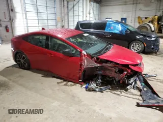 2024 Toyota Prius LE z VIN JTDADABU6R3021347, wystawiony jako Copart lot #51042095 z przebiegiem 1 460 mil mil oraz Szkoda całkowita • Salvage title. Historia ofert i sprzedaży dostępna na DreamBid. Obrazek 4.