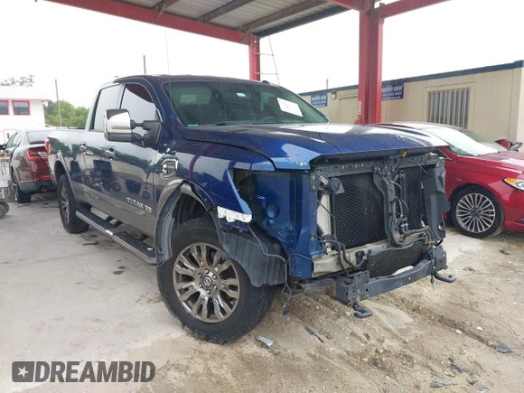 2016 Nissan Titan Platinum Reserve z VIN 1N6BA1F20GN509360, wystawiony jako IAAI lot #41921670 z przebiegiem 164 784 mil mil oraz . Historia ofert i sprzedaży dostępna na DreamBid. Obrazek 1.