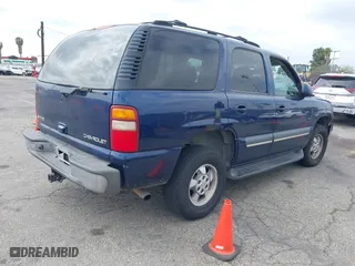 2003 Chevrolet Tahoe LS with VIN 1GNEC13T73R263893, listed as a IAAI auction lot 41906772 with 211,759 mi miles. Bid and sale history available at carsss.com. Image 4.