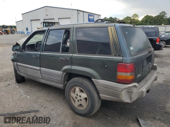 1995 Jeep Grand Cherokee Laredo with VIN 1J4FX58S0SC726476, listed as a Copart auction lot 69608784 with 264,705 mi miles and Salvage Title. Bid and sale history available at carsss.com. Image 2.