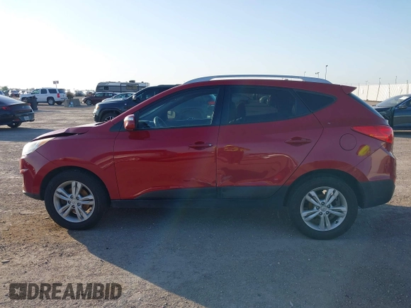 2013 Hyundai Tucson GLS with VIN KM8JU3AC6DU763590, listed as a IAAI auction lot 41999555 with 149,960 mi miles. Bid and sale history available at carsss.com. Image 14.
