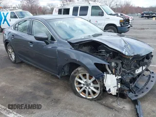 2014 Mazda 6 i Sport with VIN JM1GJ1U51E1111018, listed as a IAAI auction lot 41875461 with 253,755 mi miles and . Bid and sale history available at DreamBid. Image 1.