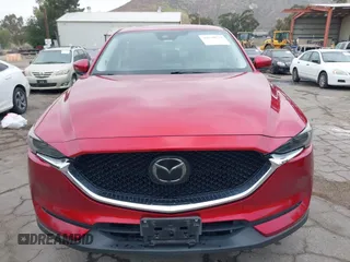 2018 Mazda CX-5 Grand Touring with VIN JM3KFADMXJ0302656, listed as a IAAI auction lot 42099173 with 125,378 mi miles and . Bid and sale history available at DreamBid. Image 12.