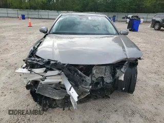 2025 Toyota Camry LE with VIN 4T1DAACKXSU556874, listed as a Copart auction lot 52694525 with 7,076 mi miles and Salvage Title. Bid and sale history available at carsss.com. Image 5.