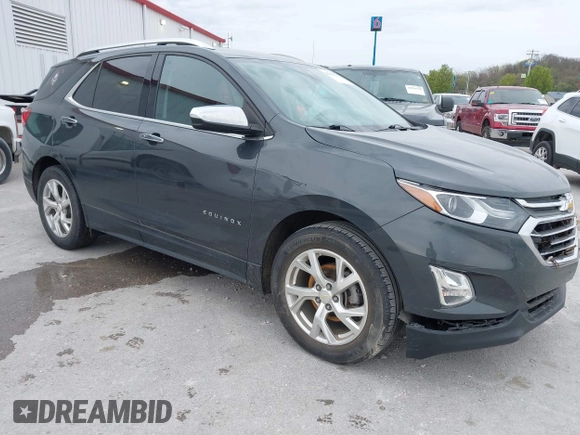 2021 Chevrolet Equinox Premier z VIN 2GNAXNEV9M6140537, wystawiony jako IAAI lot #42016514 z przebiegiem 52 237 mil mil oraz . Historia ofert i sprzedaży dostępna na DreamBid. Obrazek 1.