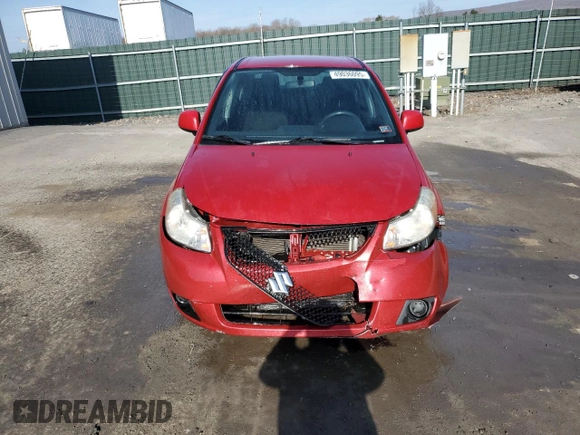 2012 Suzuki SX4 LE z VIN JS2YC5A34C6300969, wystawiony jako Copart lot #49036095 z przebiegiem 163 367 mil mil oraz Szkoda całkowita • Salvage title. Historia ofert i sprzedaży dostępna na DreamBid. Obrazek 5.