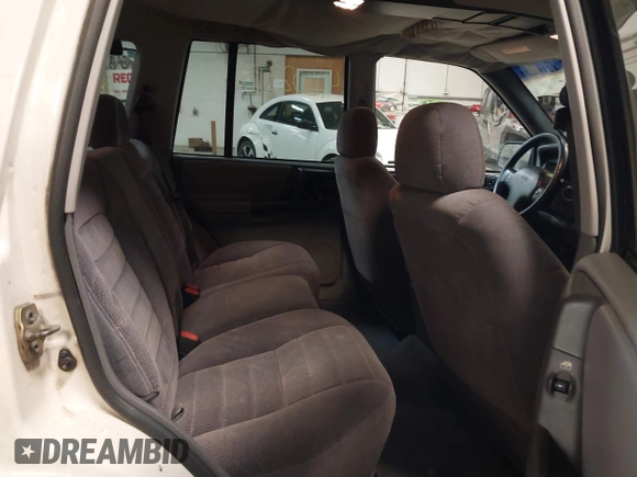 1997 Jeep Grand Cherokee Laredo z VIN 1J4GZ58S9VC562907, wystawiony jako IAAI lot #42102313 z przebiegiem 137 672 mil mil oraz . Historia ofert i sprzedaży dostępna na DreamBid. Obrazek 8.