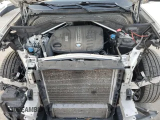 2014 BMW X5 xDrive35d z VIN 5UXKS4C53E0C07301, wystawiony jako Copart lot #54429095 z przebiegiem 106 050 mil mil oraz Szkoda całkowita • Salvage title. Historia ofert i sprzedaży dostępna na DreamBid. Obrazek 11.
