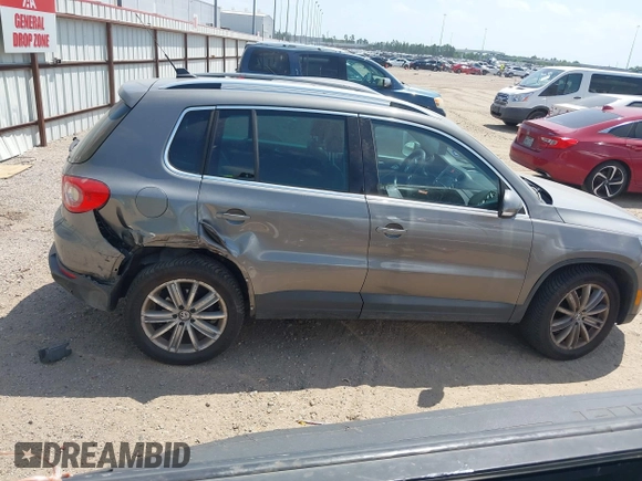 2011 Volkswagen Tiguan SEL w/Premium Navi with VIN WVGAV7AX0BW550059, listed as a IAAI auction lot 42071719 with 107,341 mi miles and . Bid and sale history available at DreamBid. Image 13.
