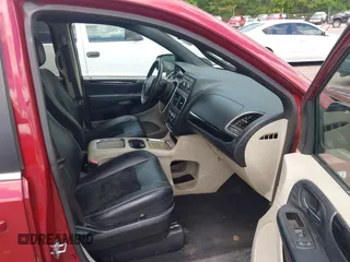 2014 Dodge Grand Caravan SXT with VIN 2C4RDGCG4ER366537, listed as a IAAI auction lot 42148032 with 126,531 mi miles and . Bid and sale history available at DreamBid. Image 5.