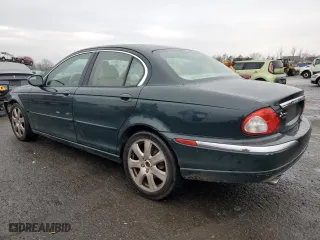 2004 Jaguar X-Type with VIN SAJEA51C84WD57149, listed as a Copart auction lot 82661344 with 146,574 mi miles and Salvage Title. Bid and sale history available at carsss.com. Image 2.