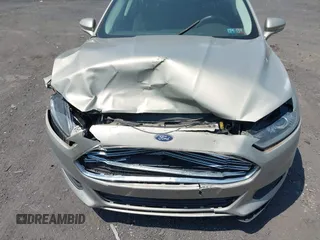 2015 Ford Fusion SE Hybrid z VIN 3FA6P0LU3FR163695, wystawiony jako IAAI lot #42428393 z przebiegiem 237 835 mil mil oraz . Historia ofert i sprzedaży dostępna na DreamBid. Obrazek 6.