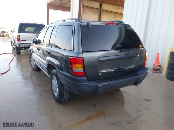 2004 Jeep Grand Cherokee Laredo with VIN 1J4GX48S04C394024, listed as a IAAI auction lot 41982608 with 142,825 mi miles. Bid and sale history available at carsss.com. Image 3.