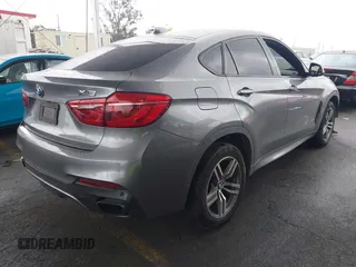 2016 BMW X6 xDrive50i with VIN 5UXKU6C59G0S82526, listed as a IAAI auction lot 41786622 with 110,796 mi miles and . Bid and sale history available at DreamBid. Image 4.