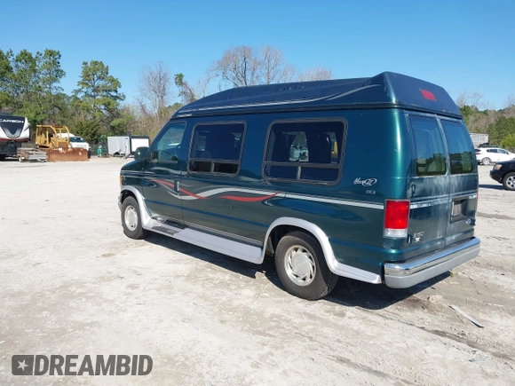 1999 Ford Econoline Cargo with VIN 1FDRE14W2XHB18989, listed as a IAAI auction lot 41740961 with 152,028 mi miles. Bid and sale history available at carsss.com. Image 3.