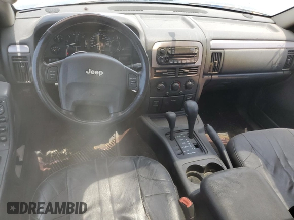 2002 Jeep Grand Cherokee Laredo with VIN 1J4GW48S52C242434, listed as a Copart auction lot 62859835 with 171,342 mi miles and Clean title. Bid and sale history available at DreamBid. Image 8.