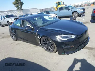 2022 Tesla Model S Plaid with VIN 5YJSA1E62NF460634, listed as a IAAI auction lot 41372644 with 16,050 mi miles and . Bid and sale history available at carsss.com. Image 1.