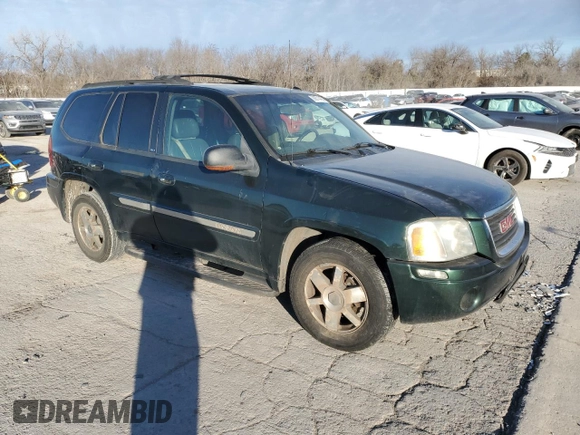 2004 GMC Envoy SLE with VIN 1GKDT13S142197514, listed as a Copart auction lot 89014465 with 202,790 mi miles and Salvage Title. Bid and sale history available at carsss.com. Image 4.
