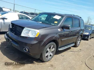 2012 Honda Pilot Touring with VIN 5FNYF4H9XCB083406, listed as a IAAI auction lot 42107651 with 217,678 mi miles. Bid and sale history available at carsss.com. Image 2.