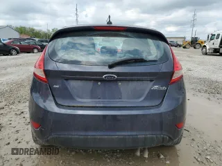 2013 Ford Fiesta SE z VIN 3FADP4EJ8DM146676, wystawiony jako Copart lot #55565485 z przebiegiem 168 801 mil mil oraz Szkoda całkowita • Salvage title. Historia ofert i sprzedaży dostępna na DreamBid. Obrazek 6.