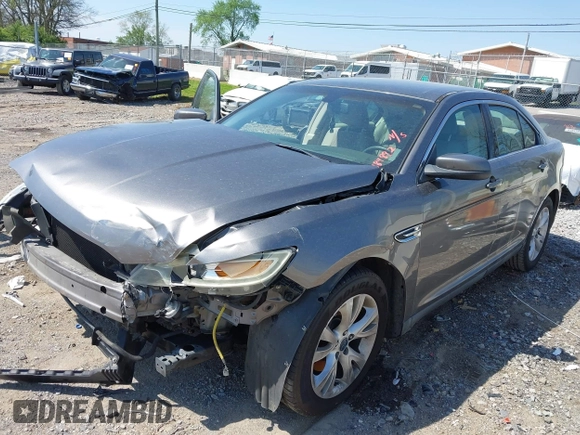 2011 Ford Taurus SEL with VIN 1FAHP2EW5BG189882, listed as a IAAI auction lot 42006542 with 208,661 mi miles. Bid and sale history available at carsss.com. Image 2.