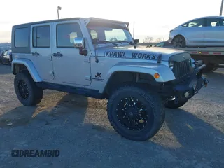 2010 Jeep Wrangler Unlimited Sahara with VIN 1J4BA5H14AL230604, listed as a IAAI auction lot 41884346 with 97,060 mi miles. Bid and sale history available at carsss.com. Image 1.