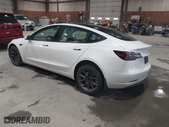 2021 Tesla Model 3 Long Range with VIN 5YJ3E1EBXMF051060, listed as a IAAI auction lot 41958018 with 65,631 mi miles. Bid and sale history available at carsss.com. Image 3.