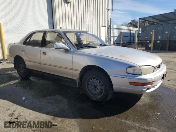 1994 Toyota Camry LE z VIN JT2GK12EXR0070117, wystawiony jako Copart lot #75997244 z przebiegiem 185 759 mil mil oraz Czysty tytuł • Clean title. Historia ofert i sprzedaży dostępna na DreamBid. Obrazek 4.
