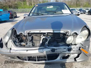 2003 Mercedes-Benz E-Class 3.2L with VIN WDBUF65J93X099223, listed as a IAAI auction lot 42033473 with 230,758 mi miles. Bid and sale history available at carsss.com. Image 6.
