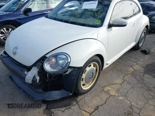 2014 Volkswagen Beetle 2.5L w/Sun with VIN 3VWJP7ATXEM628666, listed as a IAAI auction lot 41328014 with 70,990 mi miles and . Bid and sale history available at DreamBid. Image 18.