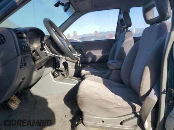1999 Isuzu Rodeo S with VIN 4S2CK58W1X4349947, listed as a Copart auction lot 84634064 with 135,851 mi miles and Clean Title. Bid and sale history available at DreamBid. Image 7.