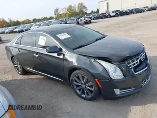 2013 Cadillac XTS Luxury with VIN 2G61P5S3XD9228218, listed as a IAAI auction lot 40503666 with 87,857 mi miles. Bid and sale history available at carsss.com. Image 1.