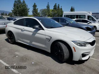 2015 BMW M4 with VIN WBS3R9C51FK334414, listed as a Copart auction lot 52451035 with 122,436 mi miles and Salvage title. Bid and sale history available at DreamBid. Image 4.
