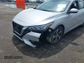 2021 Nissan Sentra SV z VIN 3N1AB8CV5MY299245, wystawiony jako IAAI lot #42180004 z przebiegiem 25 856 mil mil oraz . Historia ofert i sprzedaży dostępna na DreamBid. Obrazek 6.