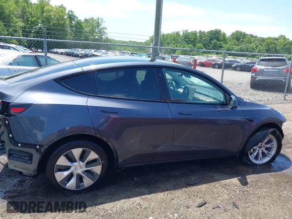 2023 Tesla Model Y Long Range with VIN 7SAYGAEE7PF615751, listed as a IAAI auction lot 42297819 with 31,201 mi miles and . Bid and sale history available at DreamBid. Image 14.