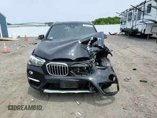 2018 BMW X1 xDrive28i with VIN WBXHT3C36J3H29952, listed as a Copart auction lot 59679285 with 75,220 mi miles and Salvage title. Bid and sale history available at DreamBid. Image 14.