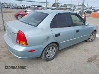 2005 Hyundai Accent GLS with VIN KMHCG45C65U576092, listed as a IAAI auction lot 41368504 with 162,208 mi miles. Bid and sale history available at carsss.com. Image 4.
