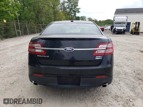 2013 Ford Taurus SEL z VIN 1FAHP2H84DG102036, wystawiony jako Copart lot #57772285 z przebiegiem 156 609 mil mil oraz Czysty tytuł • Clean title. Historia ofert i sprzedaży dostępna na DreamBid. Obrazek 6.
