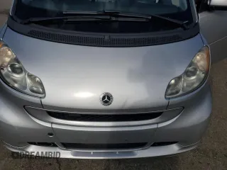 2009 Smart fortwo Pure z VIN WMEEJ31X89K276221, wystawiony jako Copart lot #57912565 z przebiegiem 118 701 mil mil oraz Szkody całkowita. Historia ofert i sprzedaży dostępna na DreamBid. Obrazek 11.