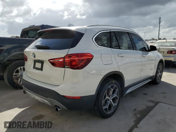 2018 BMW X1 sDrive28i with VIN WBXHU7C38J5H40248, listed as a Copart auction lot 66158662 with 59,903 mi miles. Bid and sale history available at carsss.com. Image 4.