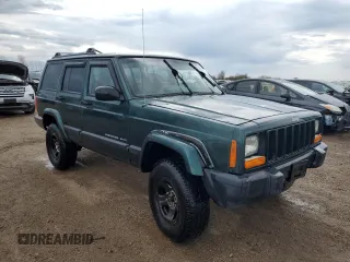2000 Jeep Cherokee with VIN 1J4FF48S3YL149593, listed as a Copart auction lot 52489045 with 290,231 mi miles and Salvage title. Bid and sale history available at DreamBid. Image 4.