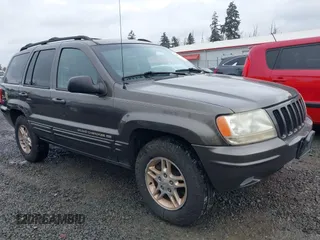 1999 Jeep Grand Cherokee Limited with VIN 1J4GW68N7XC739479, listed as a IAAI auction lot 41448323 with 129,840 mi miles. Bid and sale history available at carsss.com. Image 6.