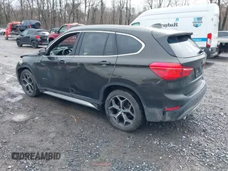 2018 BMW X1 xDrive28i with VIN WBXHT3C34J5K31430, listed as a IAAI auction lot 41954792 with 125,447 mi miles. Bid and sale history available at carsss.com. Image 3.