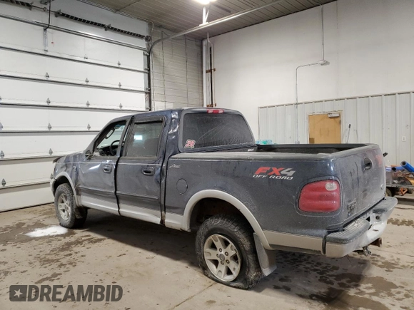 2002 Ford F-150 XLT with VIN 1FTRW08L12KE11970, listed as a Copart auction lot 45299665 with 173,802 mi miles and Salvage Title. Bid and sale history available at carsss.com. Image 2.