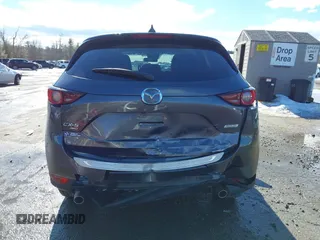 2017 Mazda CX-5 Touring with VIN JM3KFBCL3H0214881, listed as a IAAI auction lot 41694560 with 64,609 mi miles. Bid and sale history available at carsss.com. Image 16.